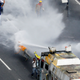 Opposition lawmaker Carlos Paparoni is hit by jets of water during riots at a march to the state ombudsman’s office in Caracas last May.
